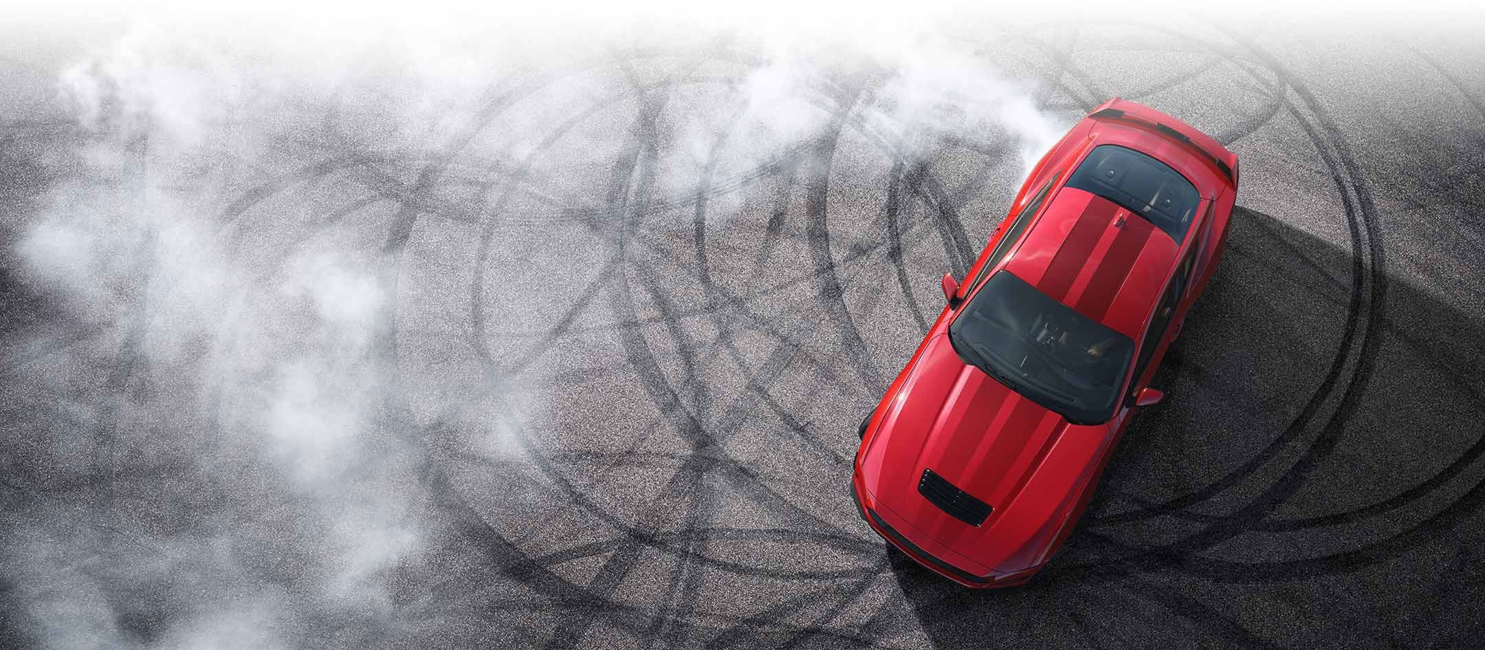 Overhead view of a 2024 Ford Mustang® model with tire tracks on pavement | Jansen Ford of Breese in Breese IL