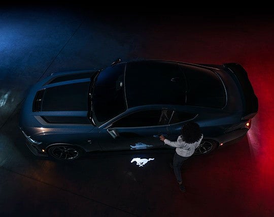 2024 Ford Mustang® Dark Horse™ model with a driver approaching the vehicle | Jansen Ford of Breese in Breese IL