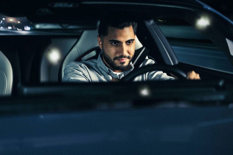 Person sitting in the driver’s seat of a parked 2024 Ford Mustang® coupe | Jansen Ford of Breese in Breese IL