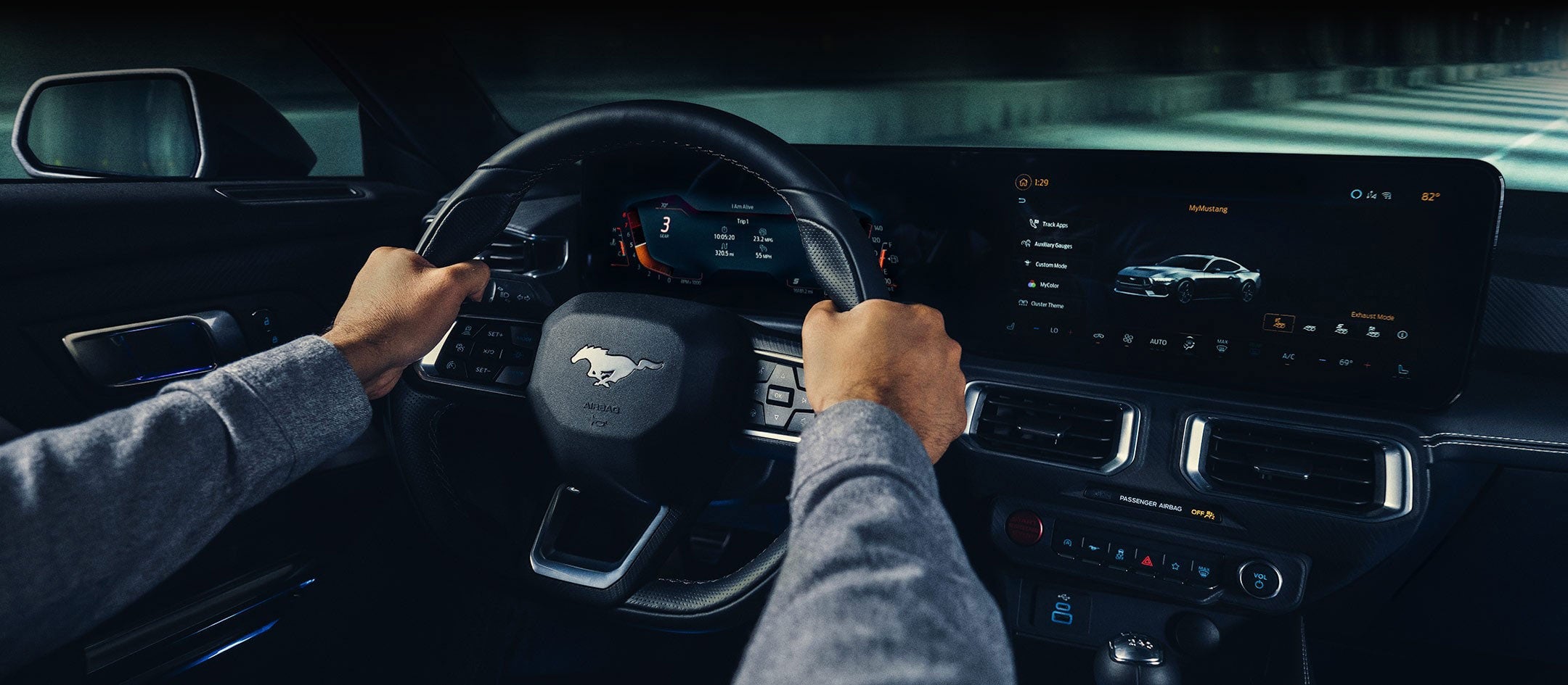 A 2024 Ford Mustang® model interior with a person driving | Jansen Ford of Breese in Breese IL